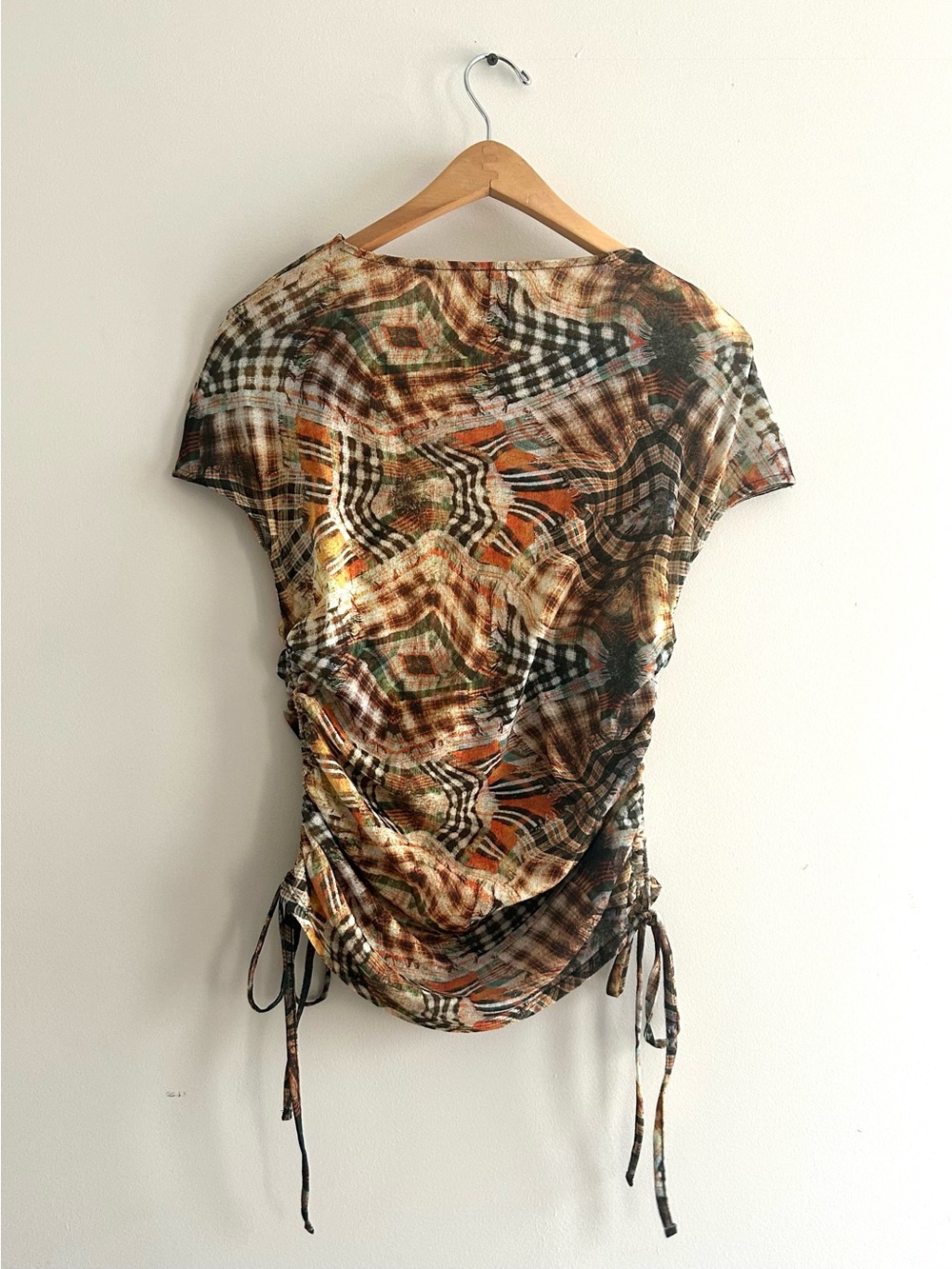 COLLUSION abstract plaid mesh cap sleeve top with ruched tie sides US 8